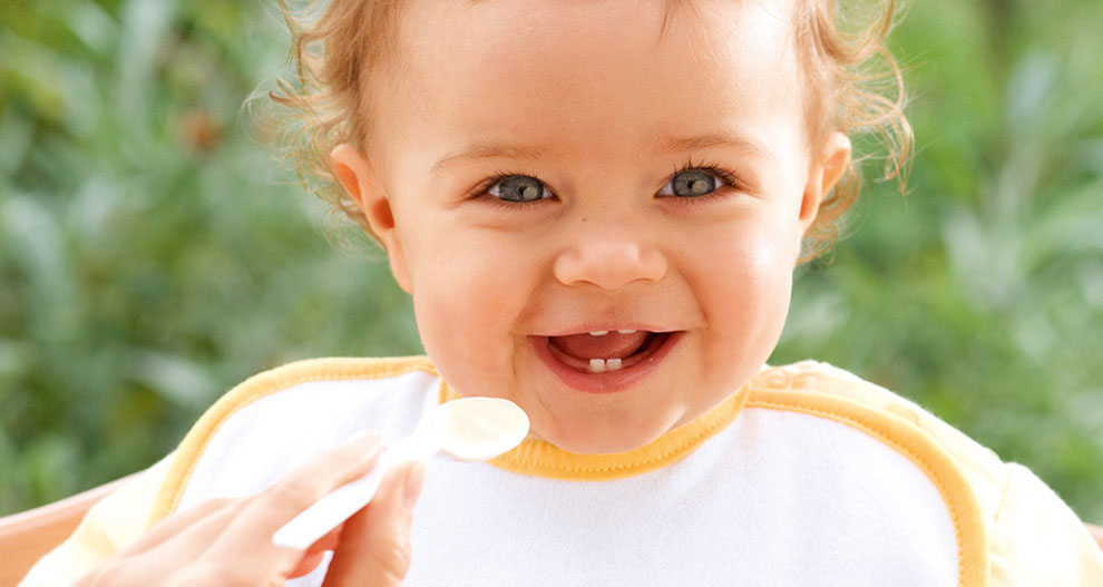 Baby with spoon.